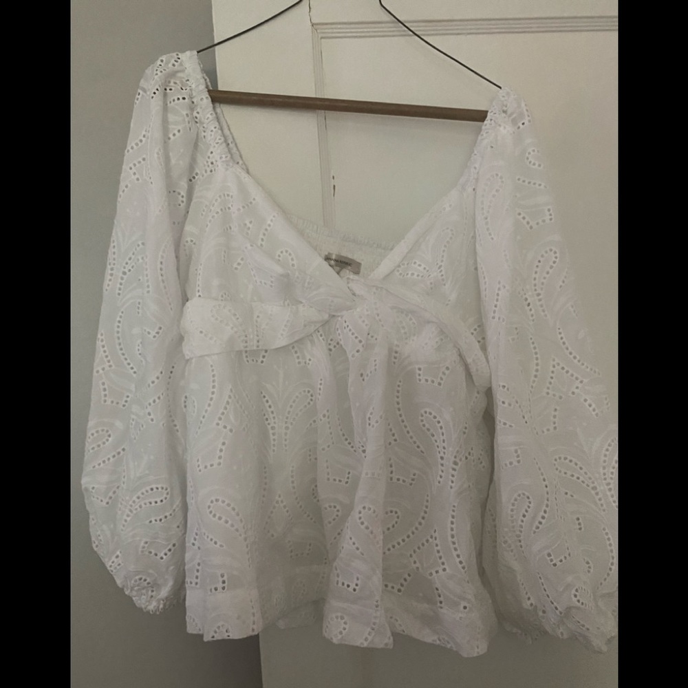 Precious eyelet puff sleeve top, new with tags. Elastic back